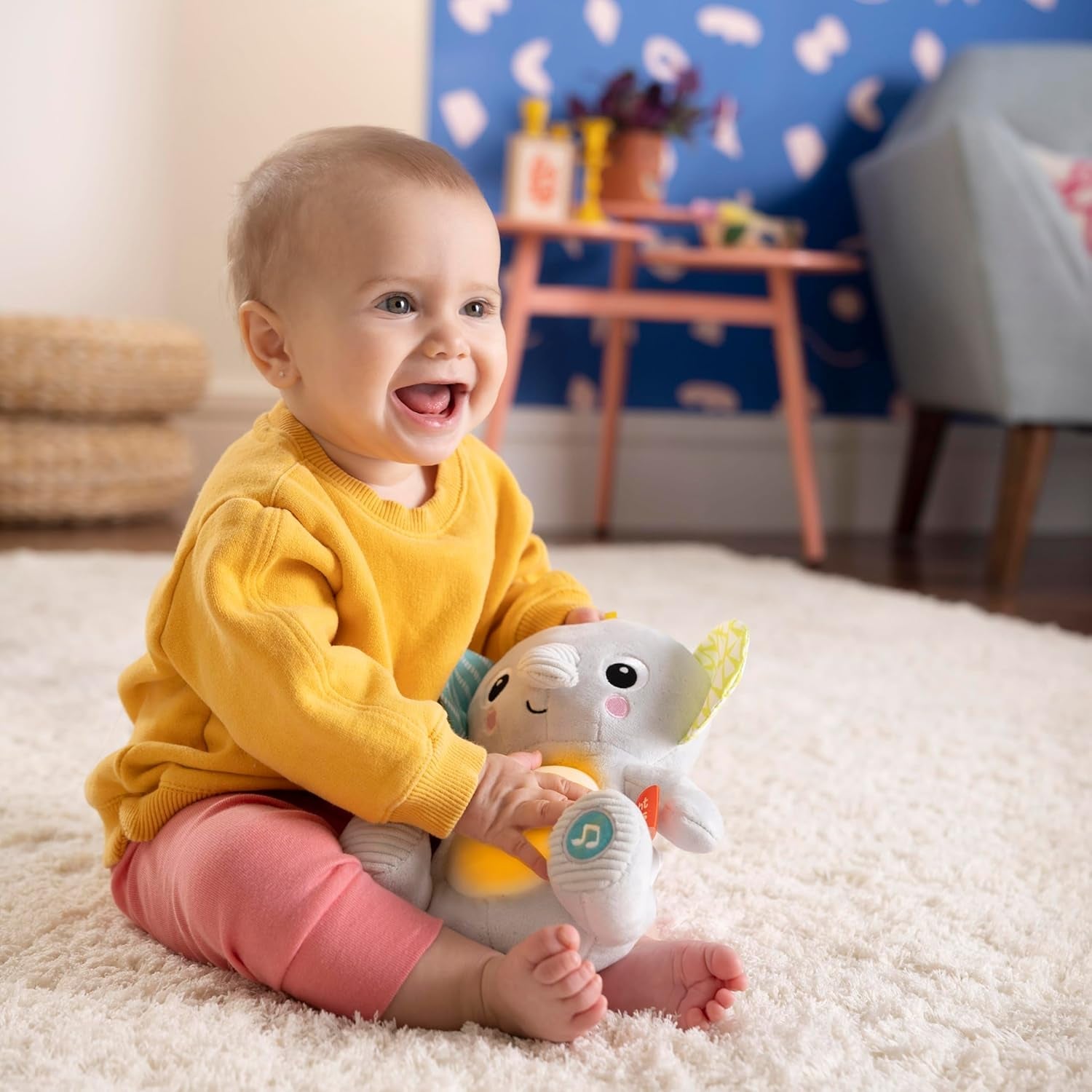 Bright Starts, Hug-a-bye baby elefant de jucărie cu lumini, melodii, texturi diferite și multe altele, multicolor Jucarii Bebe Naty Shop