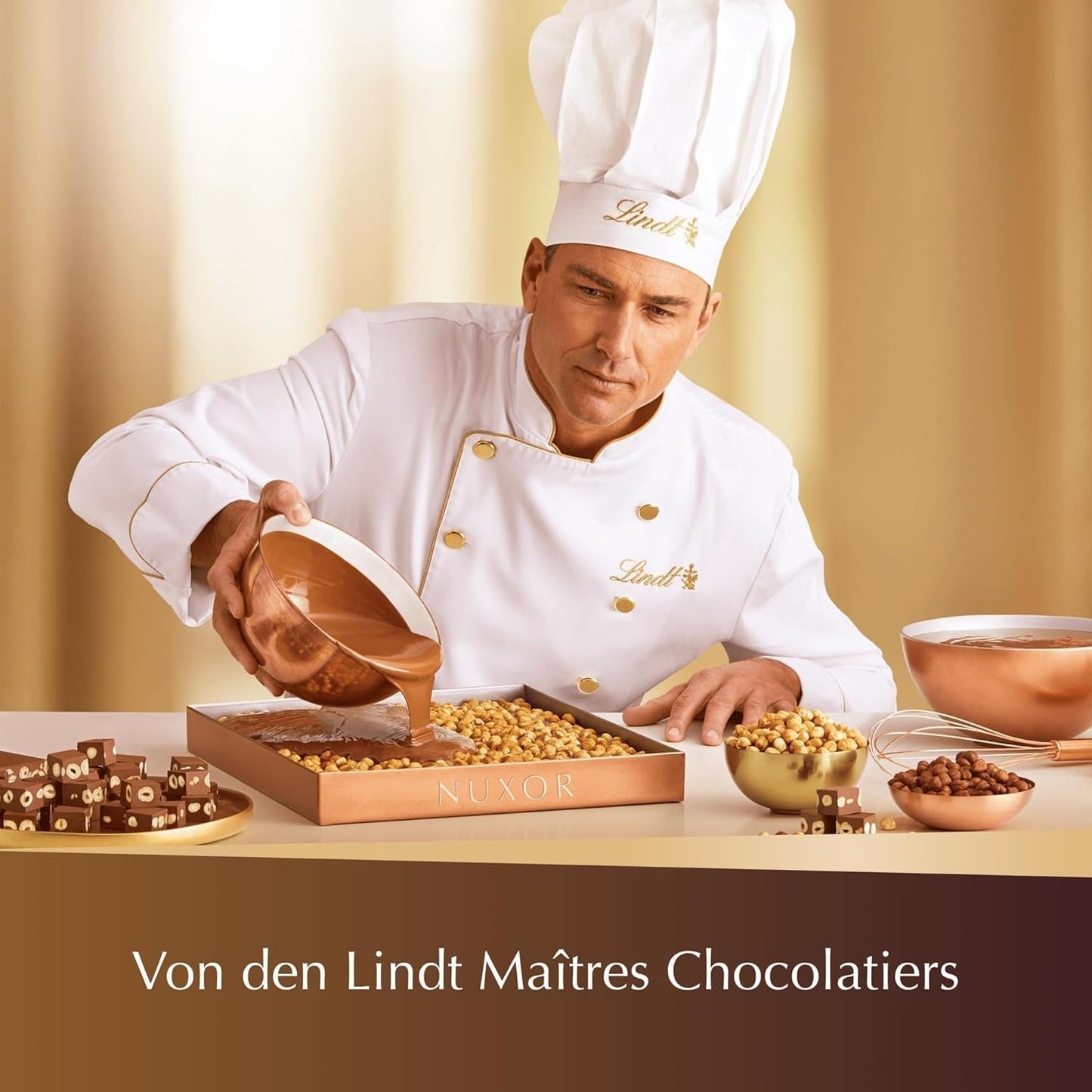 Ciocolată Lindt NUXOR alba cremoasă cu alune prăjite întregi, 103 grame Naty Shop