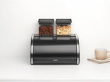 Brabantia roll bread box - Cutie de depozitare compactă pentru pâine, covrigi și rulouri pe blatul de lucru, cu capac plat, oțel durabil - dimensiune medie - negru mat Cutii depozitare alimente Naty Shop