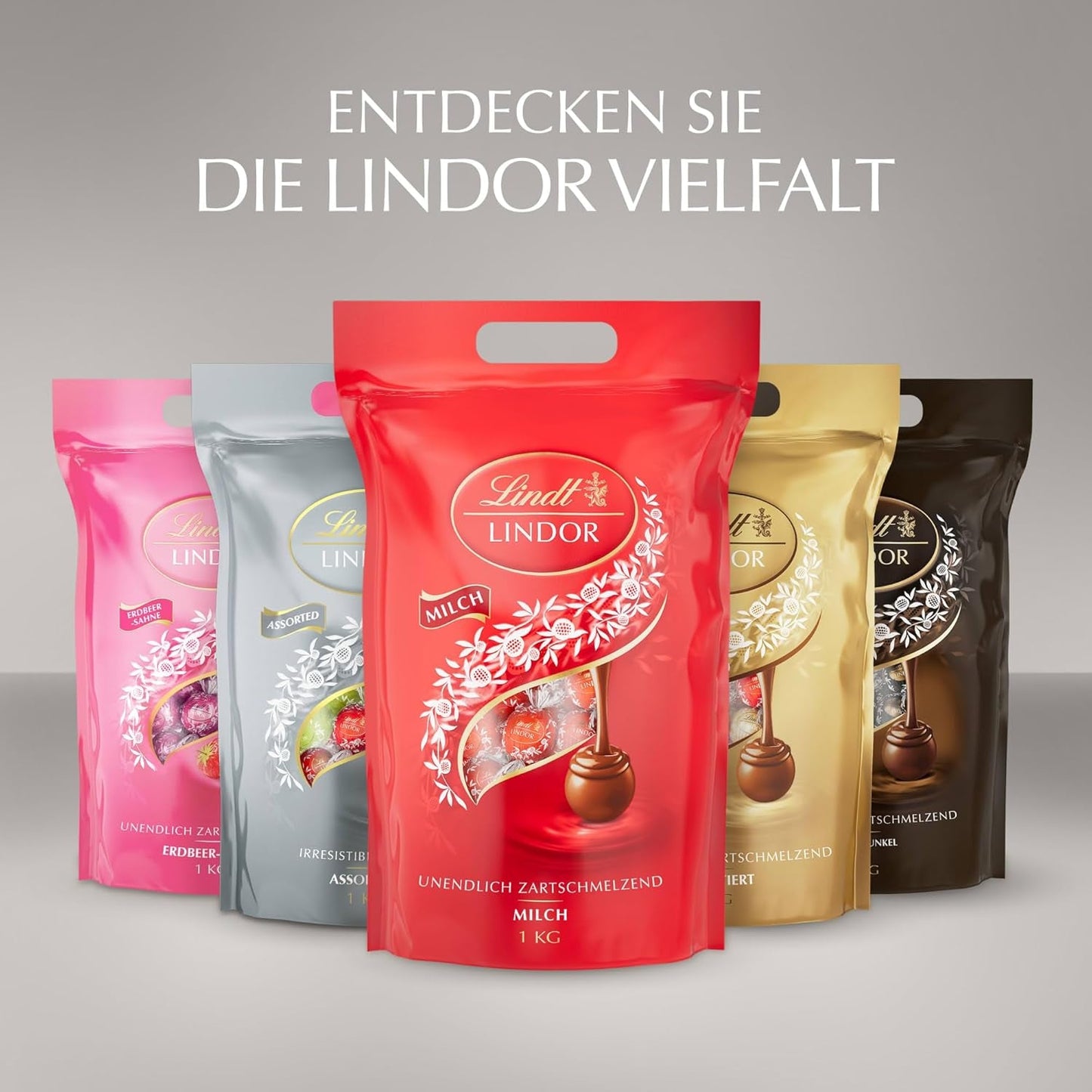 Lindt Chocolate | Pungă asortată LINDOR argintie | Pungă de 1 kg | 80 de bile de ciocolată care se topesc în gură în lapte, 70%, arome de caramel sărat și ciocolată dublă | Cadou de ciocolată de împărțit