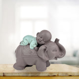 Zen'Light Statue Buddha Bonze Sleeping on Elephant - Atmosferă Zen în spațiul tău sacru - frumoasă figură de bun augur -H 9.5 cm, Brown & Green Statuete si sculpturi Naty Shop